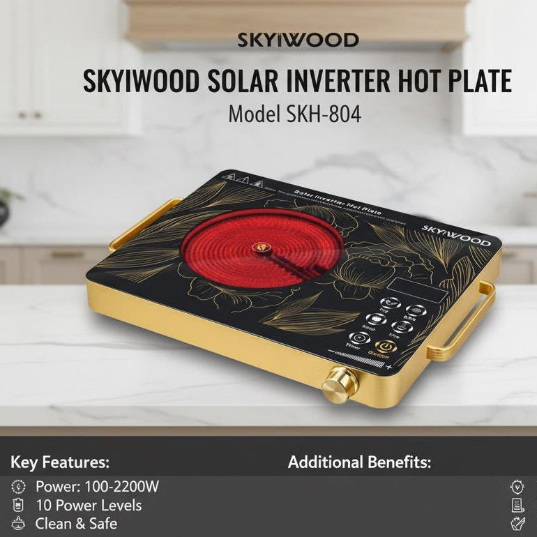 A SKYIWOOD solar inverter hot plate, model SKH-804, displayed on a white marble kitchen countertop with a blurred modern kitchen background. The product features a black top surface with a red circular graphic, gold handles and trim, and a gold side frame.